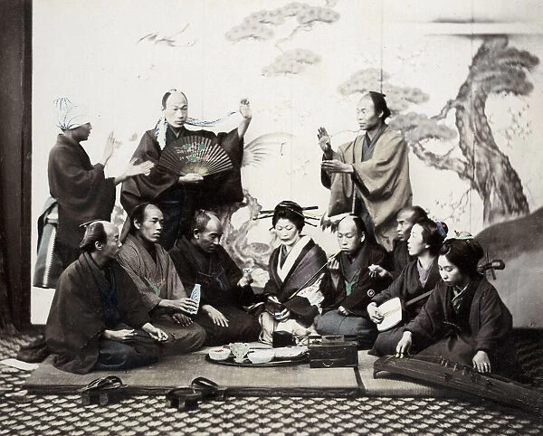 1860s Japan - portrait of a group of men and women enjoying a social meal with music
