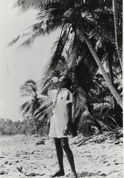 Boy scout on a beach, Gilbert Islands, Pacific