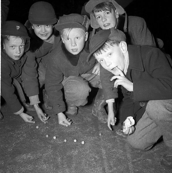 Boys playing marbles