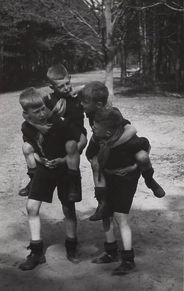 Dutch boy scouts playing piggyback, Holland