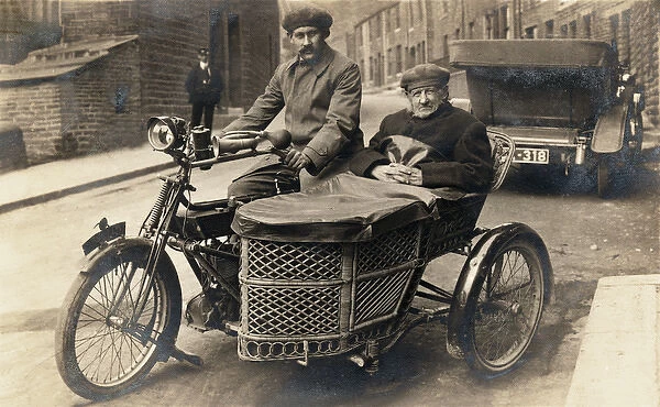 Two gentlemen on 1907 Royal Enfield motorcycle & sidecar