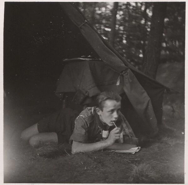 German boy scout in a tent at camp