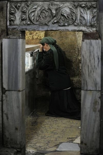 Israel. Jerusalem. Tomb of the Virgin Mary. Woman praying