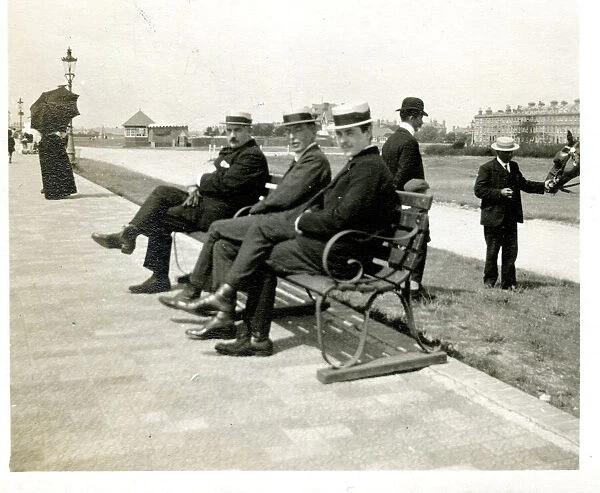 Three men on a bench, Littlehampton, West Sussex