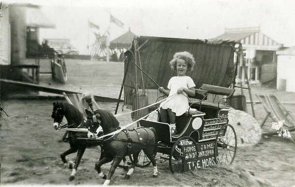Primative Fairground  /  Beach Amusements - Girl on buggy