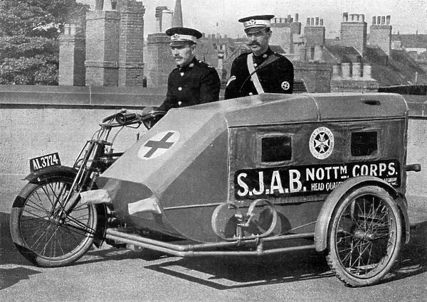 A Red Cross Ambulance with motor-cycle attached