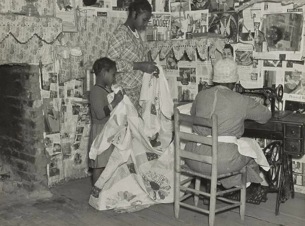 Sewing a quilt. Gees Bend, Alabama