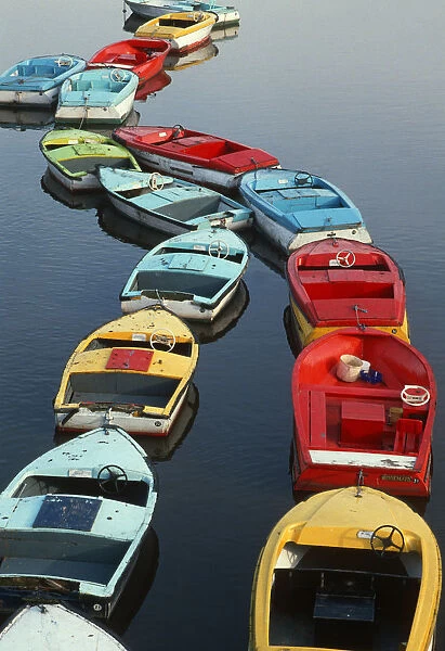 Small colourful boats for hire on the River Dee, Chester