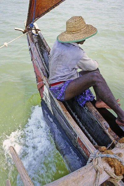 Sri Lankan fisherman in outrigger boat - 2