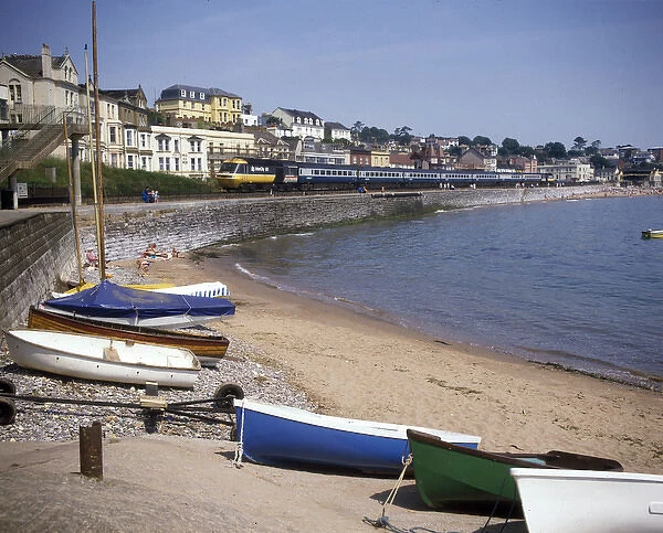 View of cove with boats and train, Dawlish, Devon