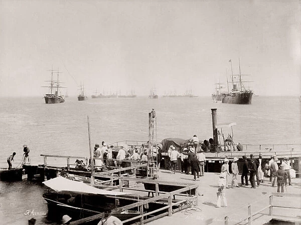 Vintage 19th century photograph: pier at Ismailia, steam launch and ships in the harbour