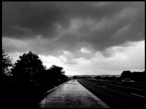 Wet road and stormy sky, UK