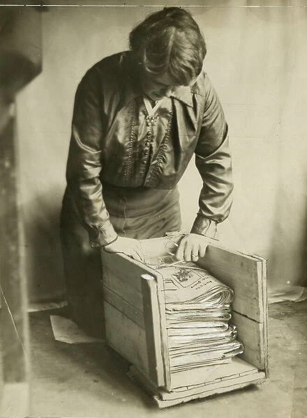 Woman saving paper during WW1