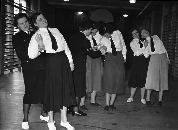 Women police officers training in a gym, London