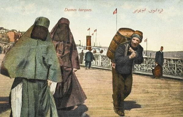 Two women with full veils on the Galata Bridge