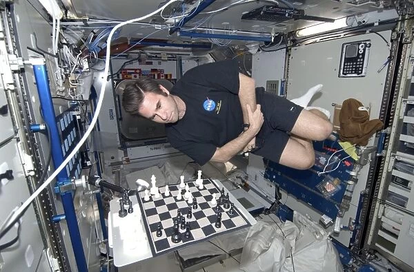Astronaut chess game on the ISS C016  /  4205