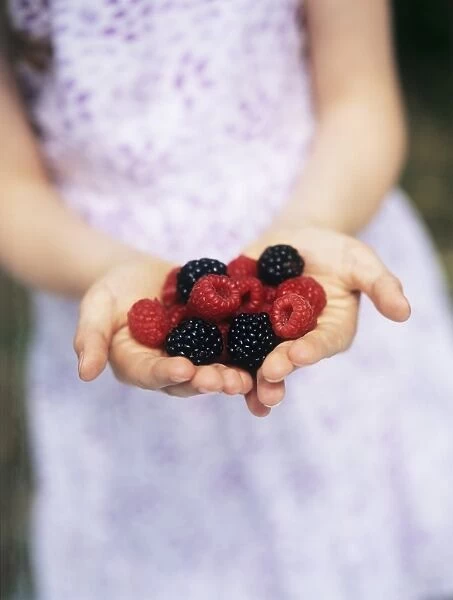 Child holding berries