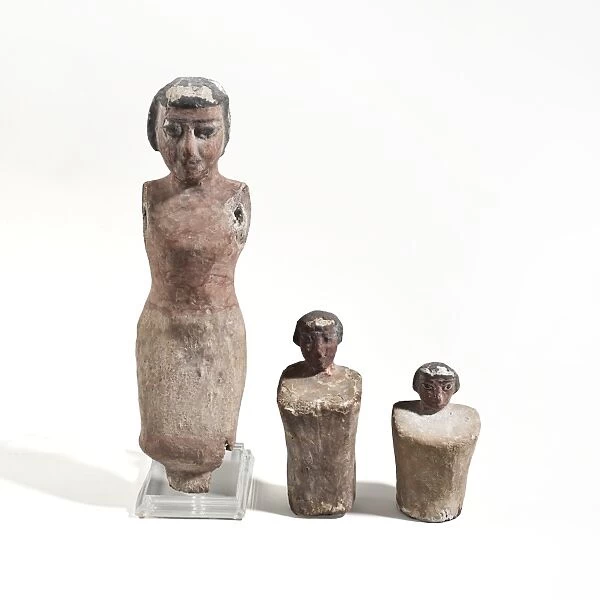 Three Egyptian wooden figurines