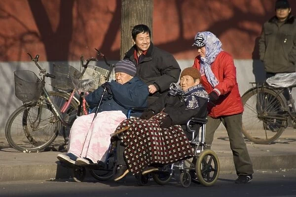 Elderly Chinese in wheelchairs