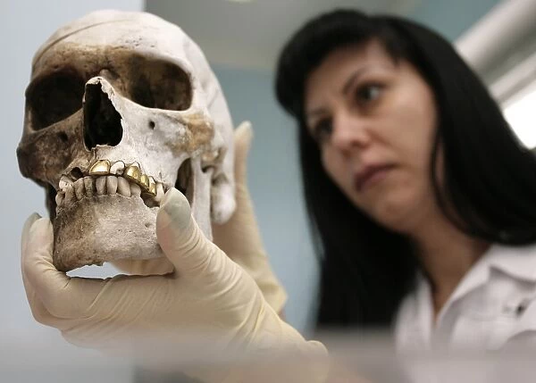 Forensic scientist with human skull