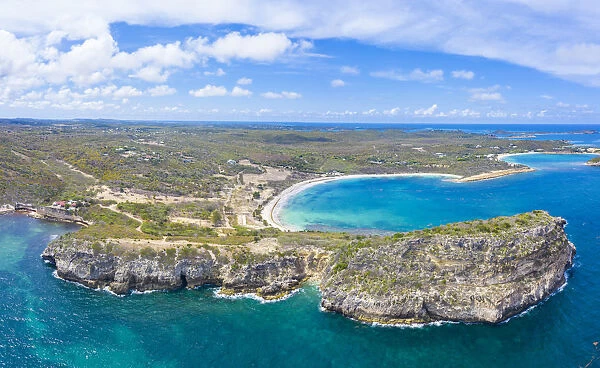 Aerial panoramic by drone of cliffs surrounding Half Moon Bay washed by Caribbean Sea
