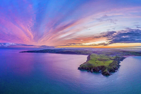 Aerial sunrise view over Baggy Point towards Woolacombe, Morte Bay, North Devon, England