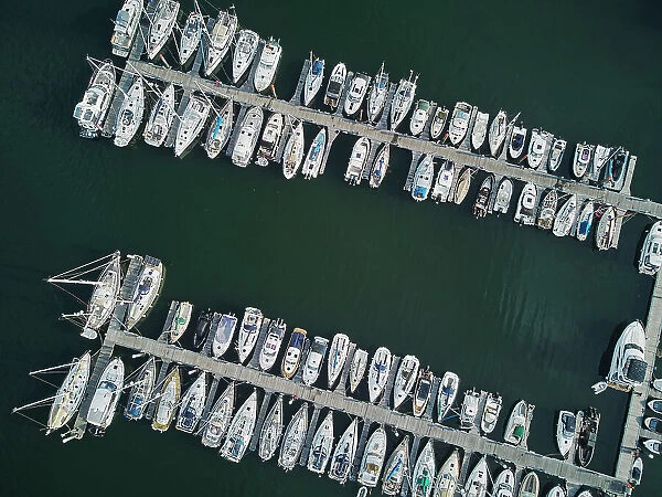 An aerial view looking straight down of yachts tied up in the Dart Marina, on the River Dart, Kingswear, on the south coast of Devon, England, United Kingdom, Europe