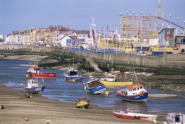 Amusement park and boats in mouth of River Clwyd