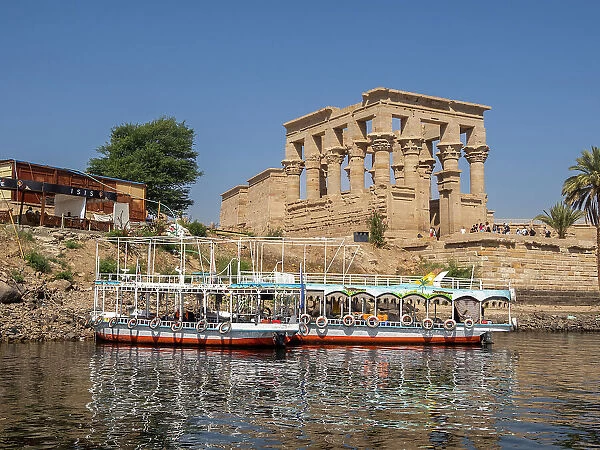 Boats gathering to take tourists to the Philae temple complex, The Temple of Isis, on the island of Agilkia, UNESCO World Heritage Site, Egypt, North Africa, Africa
