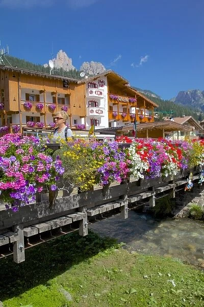 Bridge and flowers, Pozza di Fassa, Fassa Valley, Trento Province, Trentino-Alto Adige  /  South Tyrol, Italian Dolomites, Italy, Europe