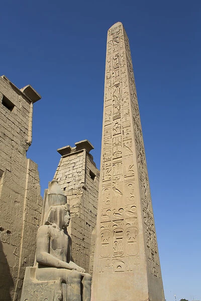 Colossus of Ramses II in front of Pylon, Obelisk, Luxor Temple