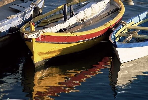 Colourful boats reflected in the water of the harbour, Sete, Herault, Languedoc-Roussillon