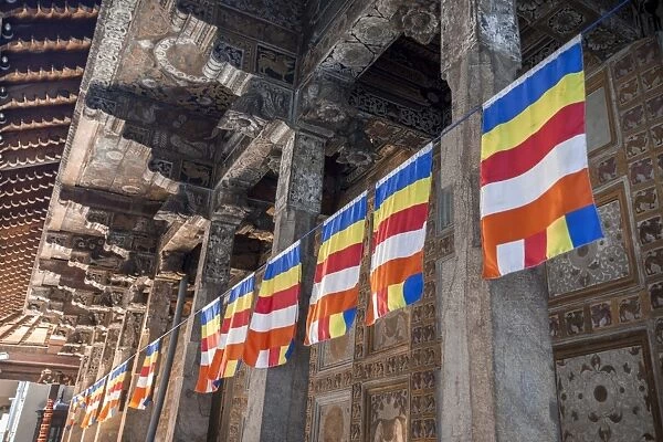Colourful Buddhist flags adorning columns, Temple of the Sacred Tooth Relic, UNESCO World Heritage Site, Kandy, Sri Lanka, Asia