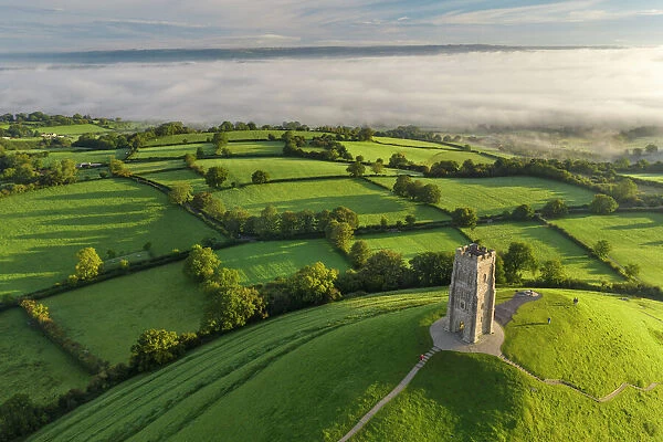 Early morning mists at St. Michaels Tower on Glastonbury Tor in Somerset, England, United Kingdom, Europe