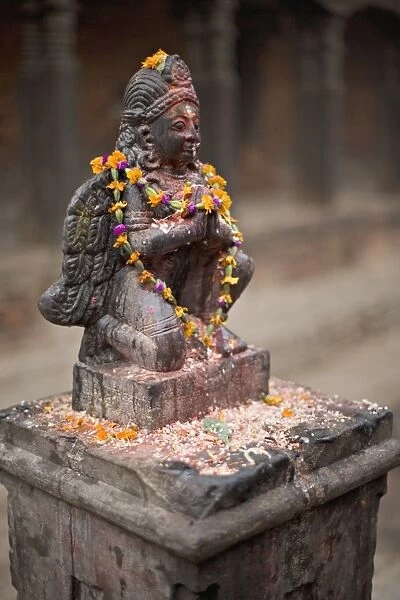 Garuda statue with pooja offerings