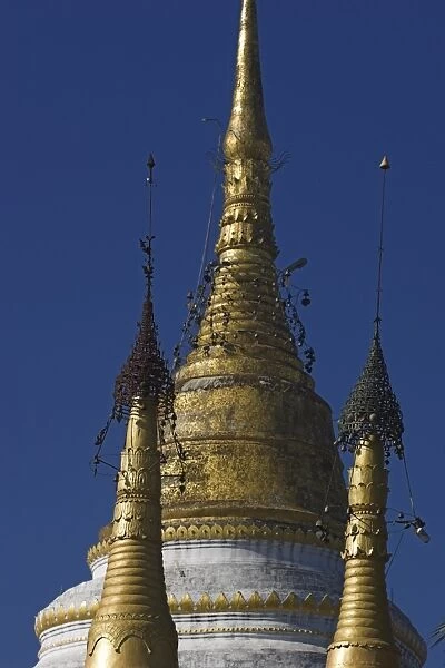 Gilded zedi, said to contain Buddhas hair relics, topped by gold hti inlaid with silver