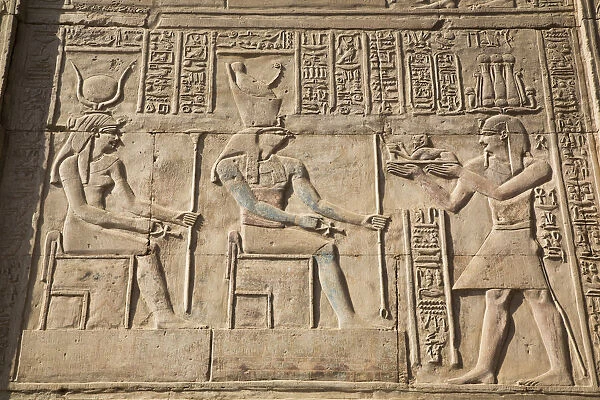 Gods Hathor on left and Haroeris in centre with Pharaoh on the right, Wall Reliefs