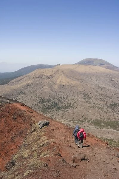 Hikers, volcanic scenery and hiking trail