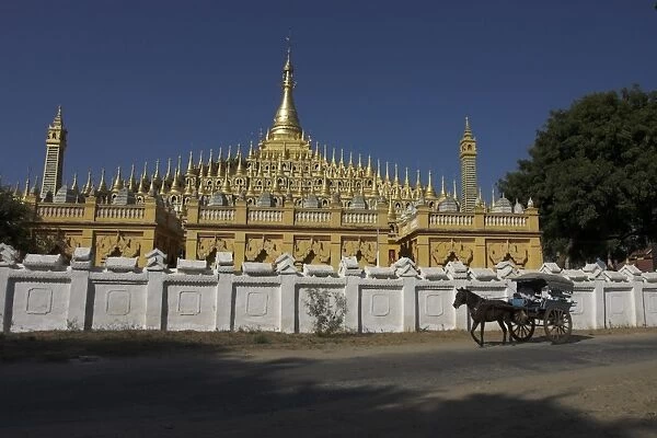 Horse and cart passing the Thanboddhay Paya, built between 1939 and 1952 by Moehnyin Sayadaw