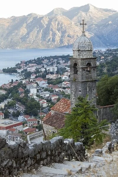 Kotor Old Town and fortifications at dawn with the Church of our Lady of Remedy in the foreground, Bay of Kotor, UNESCO World Heritage Site, Montenegro, Europe