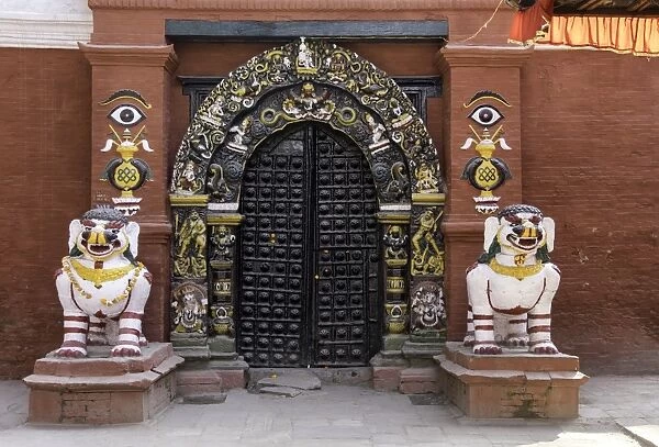 Lion statues outside a gate at the Taleju Temple, Durbar Square, Kathmandu, Nepal, Asia