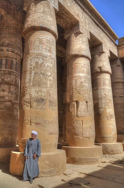 Local man, Columns in the Great Hypostyle Hall, Karnak Temple, Luxor, Thebes, UNESCO