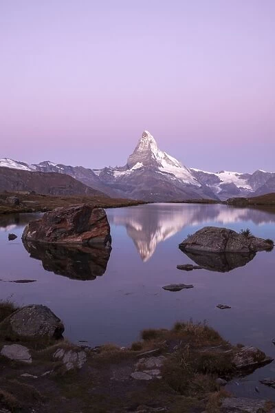 The Matterhorn reflected in the Stellisee at dusk, Zermatt, Canton of Valais, Pennine Alps