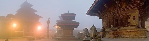 Misty winter dawn and temples in Durbar Square