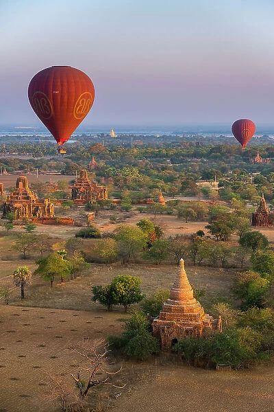 Old temples in Bagan and hot-air balloons before sunrise, Old Bagan (Pagan), UNESCO World Heritage Site, Myanmar (Burma), Asia