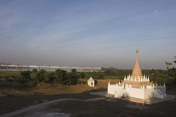 Pagoda at Maha Aungmye Bonzan monastery with the Ava bridge over the Ayeyarwaddy River beyond
