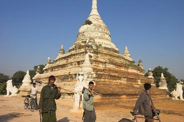 People walk past temple, Sagaing Hill, Sagaing, near Mandalay, Myanmar (Burma), Asia