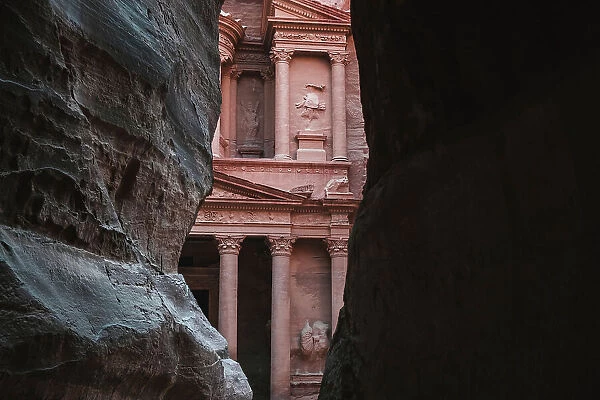 Petra Treasury (El Khazneh) partially hidden, reveals itself at the end of the Siq canyon, Petra, UNESCO World Heritage Site, Jordan, Middle East