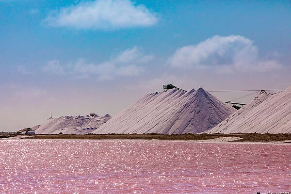 Pink colored ocean overlooking the Salt Pyramids of Bonaire, Netherlands Antilles