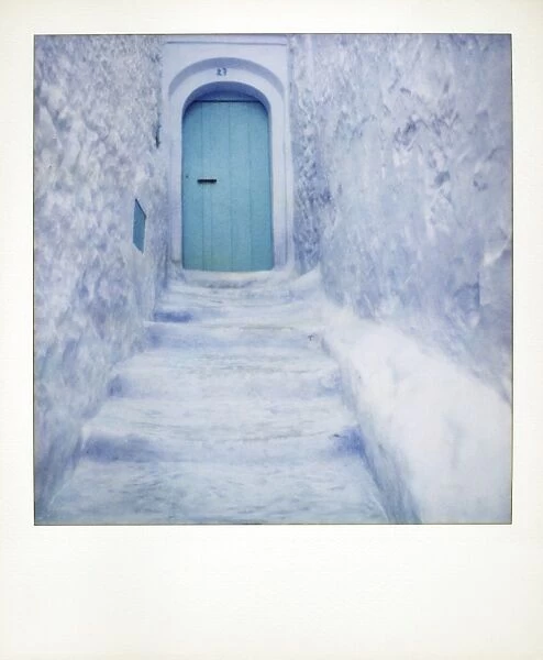 Polaroid of traditional bluewashed street and walls